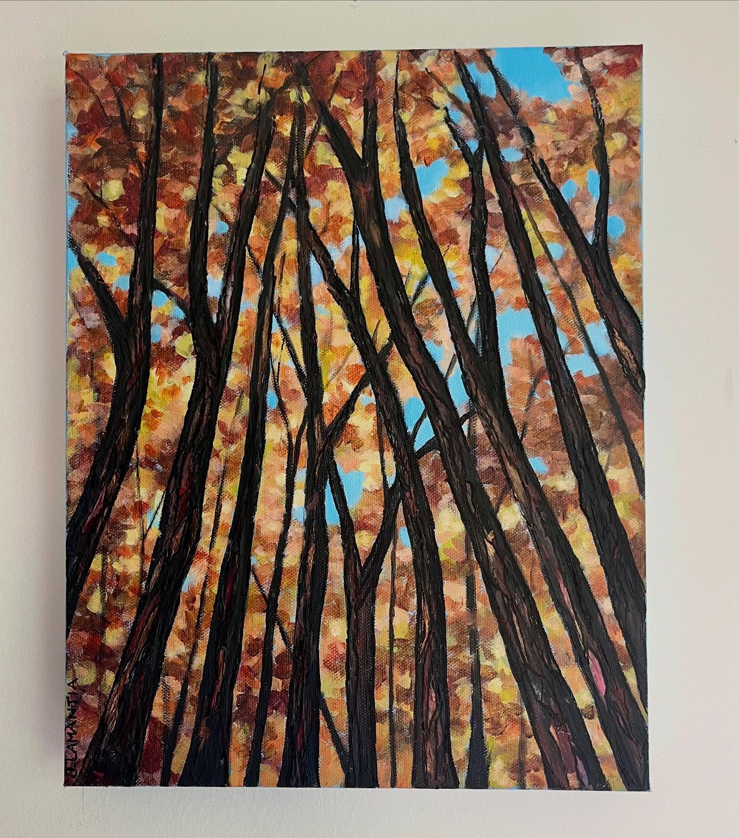 Autumn Forest Painting — Tall trees with autumn-colored leaves against a bright blue sky